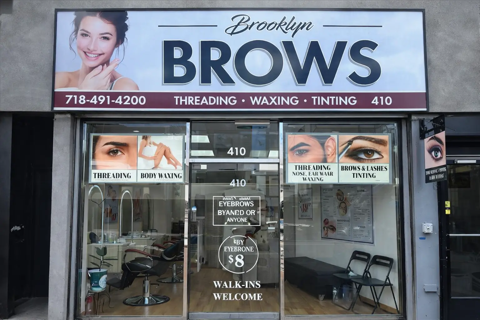 Beauty salon in NYC with a technician threading eyebrows, emphasizing self-care and grooming