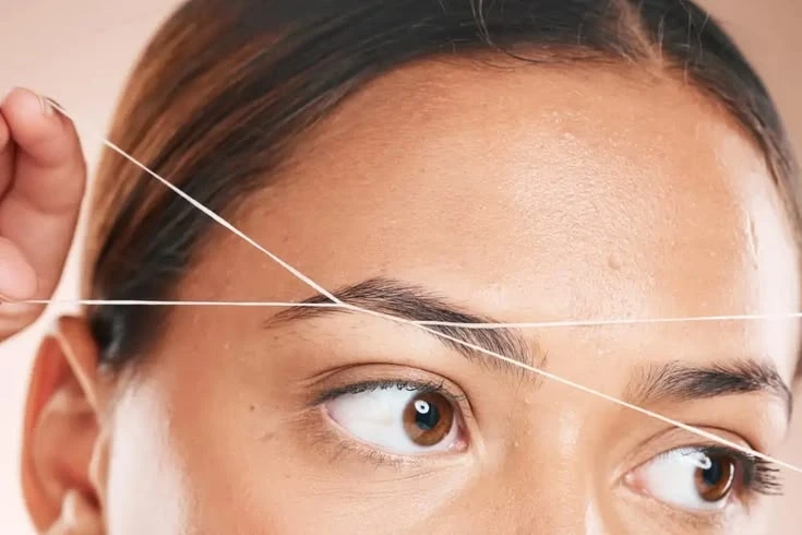 Expert eyebrow threading service for precise shape and symmetry