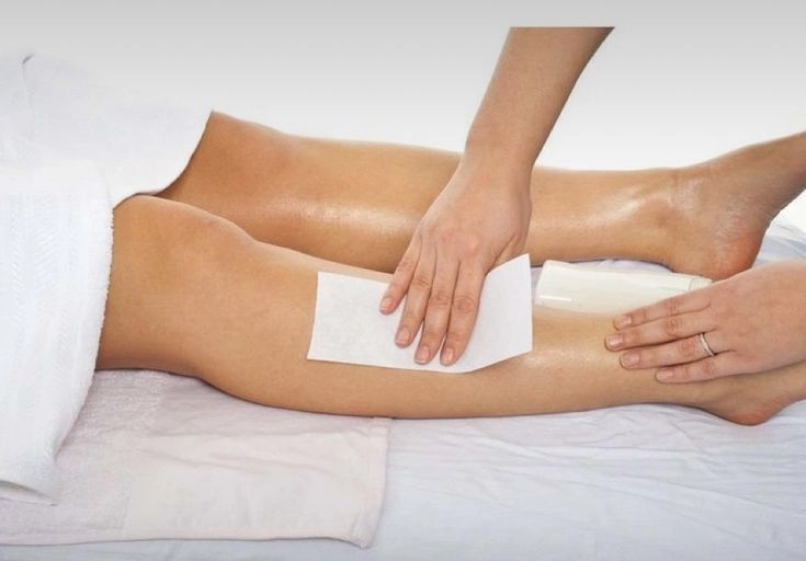 Brooklyn Brows NYC aesthetician applying wax for smooth hair remova