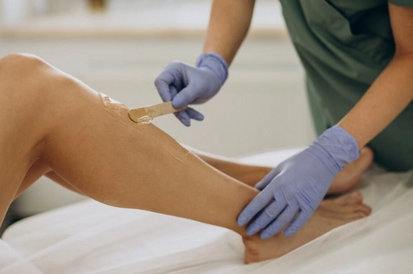 Full Brazilian wax application showing gentle hair removal technique in Brooklyn
