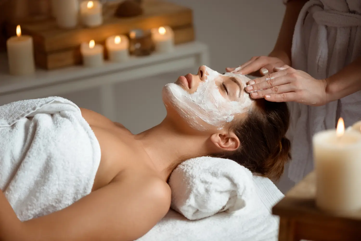 Esthetician performing organic facial skincare application process